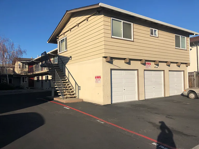 The private garage for apartment #11 is in the patio area and has new lighting, fresh paint, and an easy roll up door.