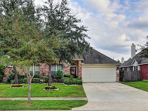 Lovely one-story with professionally landscaped yard.