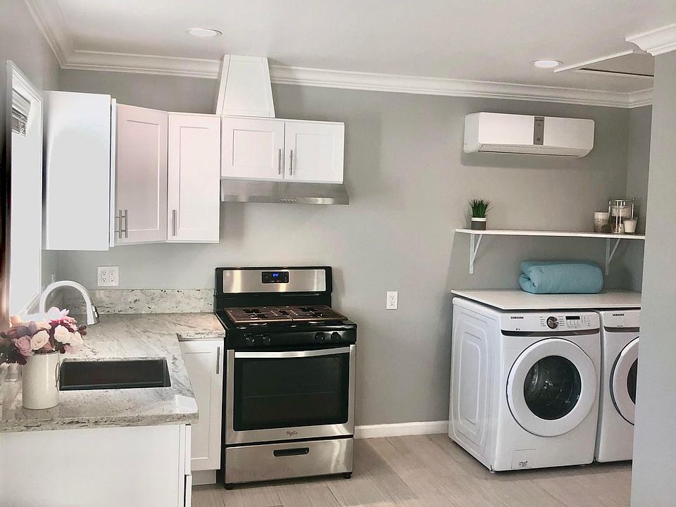 Kitchen area with large window overlooking the patio