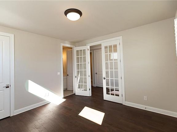 floor plans that offer flexible space for office or guest bedrooms on the main floor