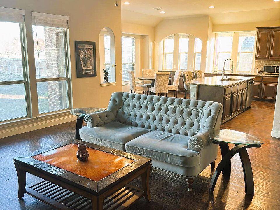 Spacious open concept, modern Living room, kitchen, and breakfast area.