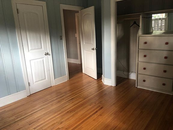 Front bedroom with 2 closets. Built ins in larger closet with bifold closet doors