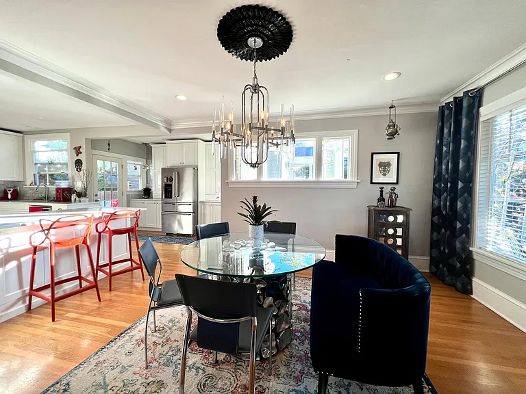 Dinning room off of kitchen. Lots of natural light through the windows.