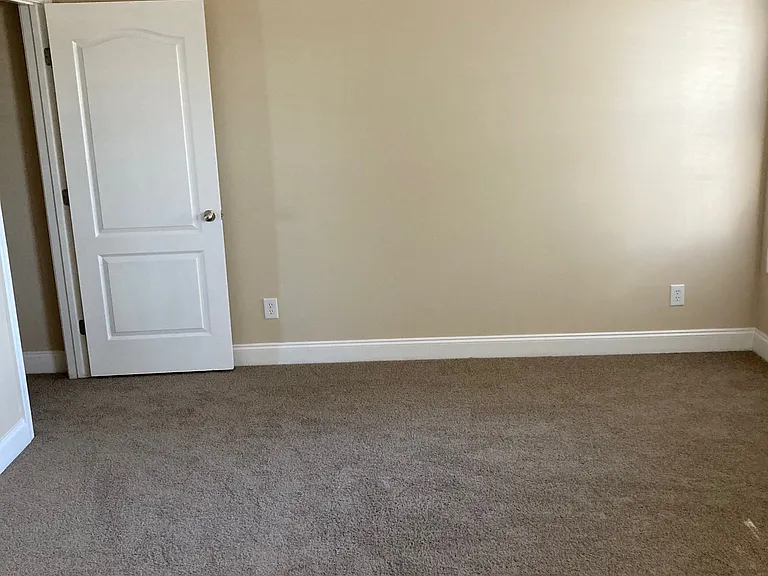 Master bedroom with vaulted ceiling