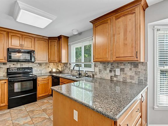 Quartz countertops and custom backsplash