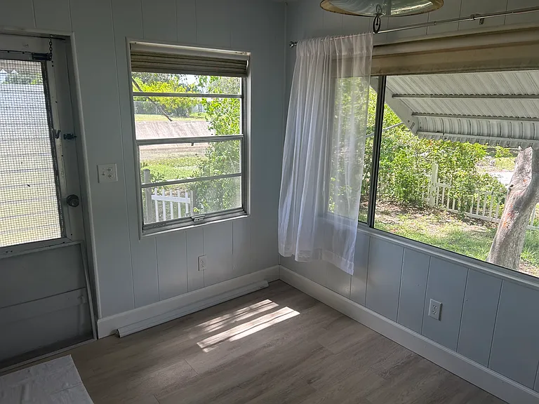 Dining room - new door with window has replaced the one shown.