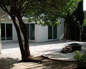 backyard includes a fire pit, barbecue and faucet