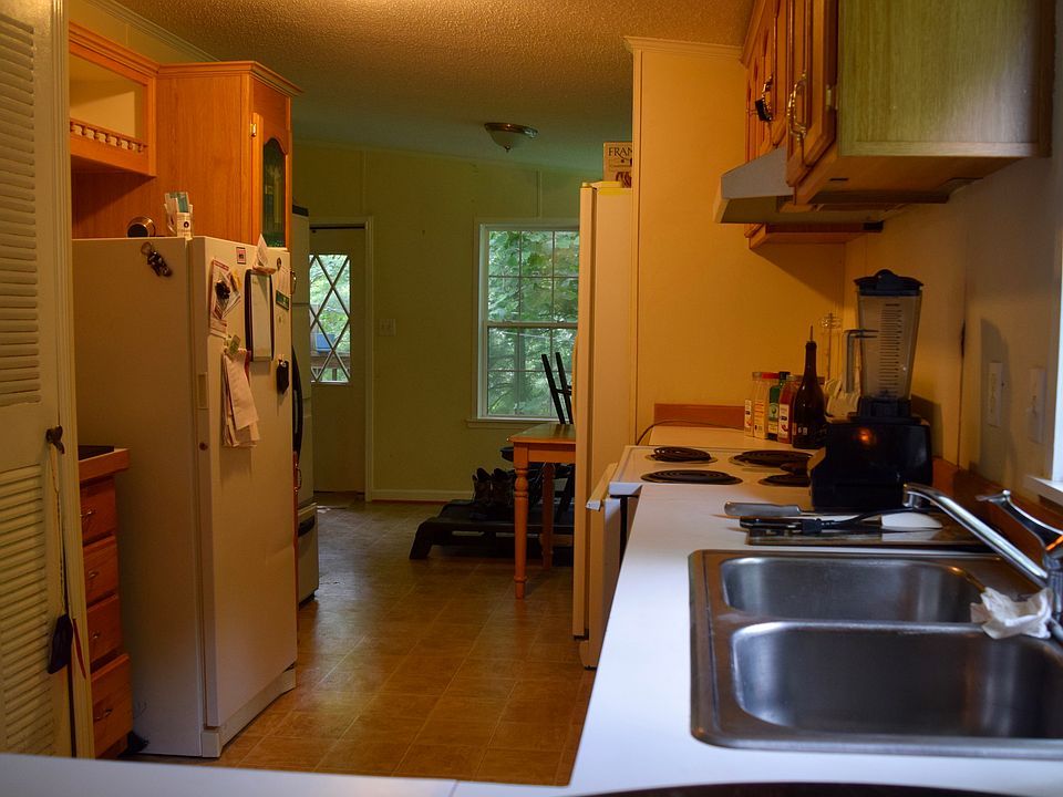 View of kitchen and breakfast room from dining room