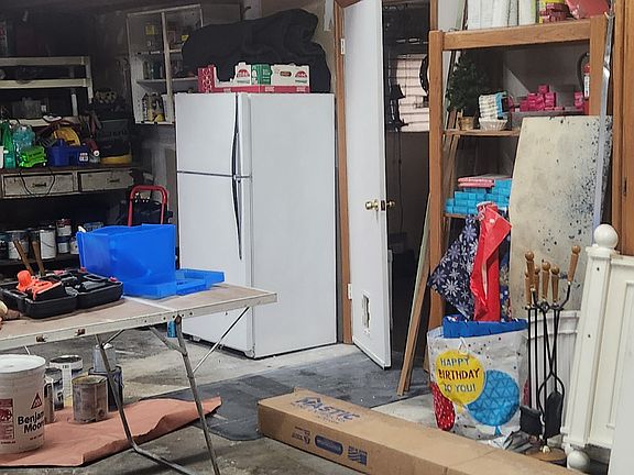 Garage will be cleaned up this was during remodle .Has washer and dryer and extra fridge lots of storage