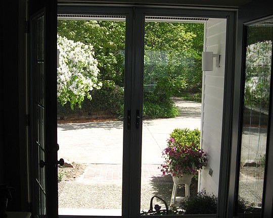 Let the sunshine in!  Beautiful French doors welcome you to the beach.