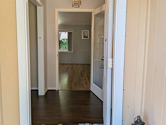 Step inside to the foyer, with the living and dining area on the left and the family room straight ahead.
