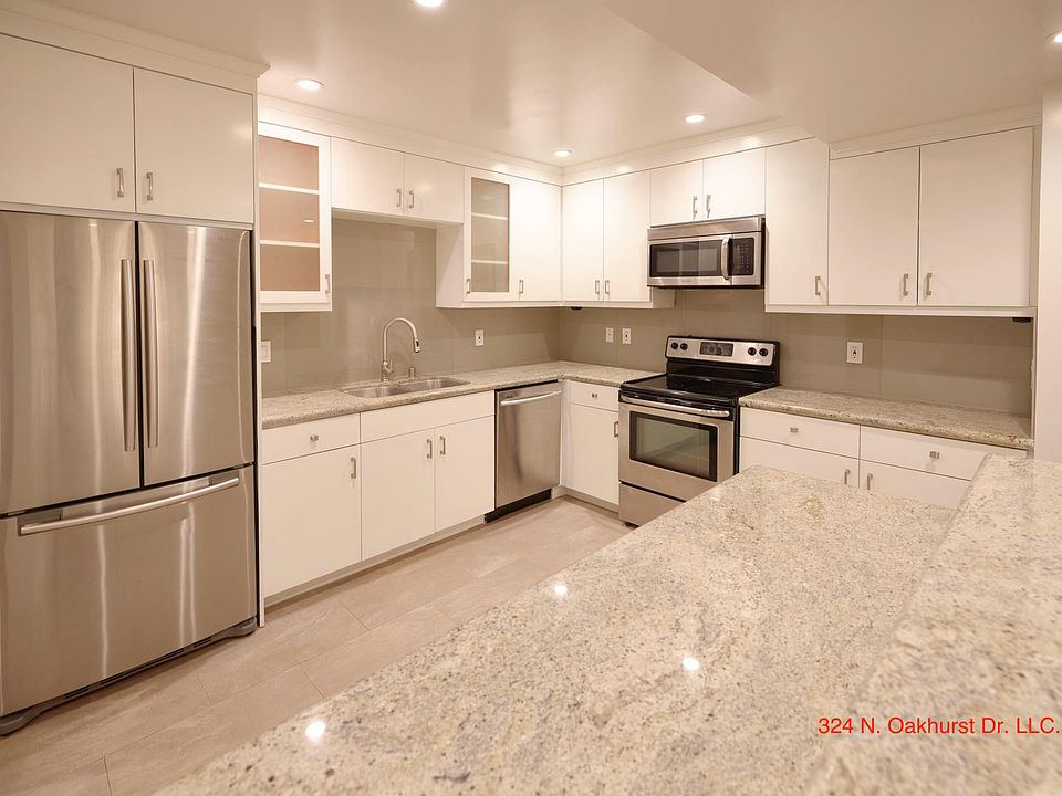 Upgraded and Modern Kitchen with Granite Counters, Stainless Steel Appliances and Custom Cabinets