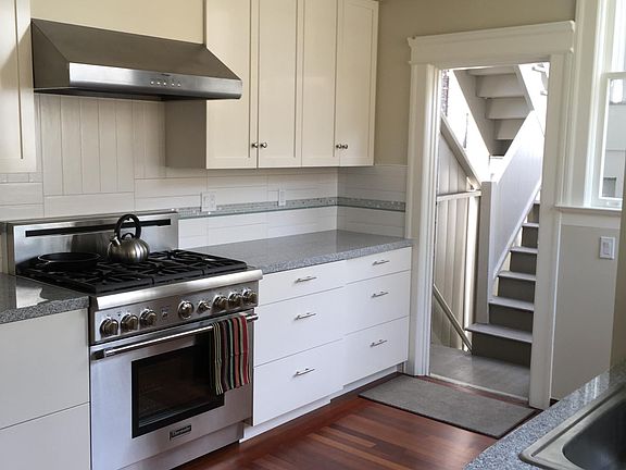 new kitchen cabinets, appliances, granite countertops, tile splashes, refinished sustainable cherry floor