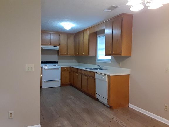 Spacious kitchen with lots of cabinet storage and new flooring