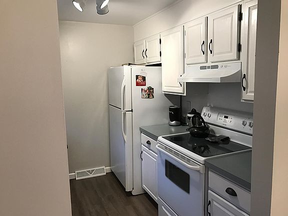 Kitchen is bright and cheerful, with new floor