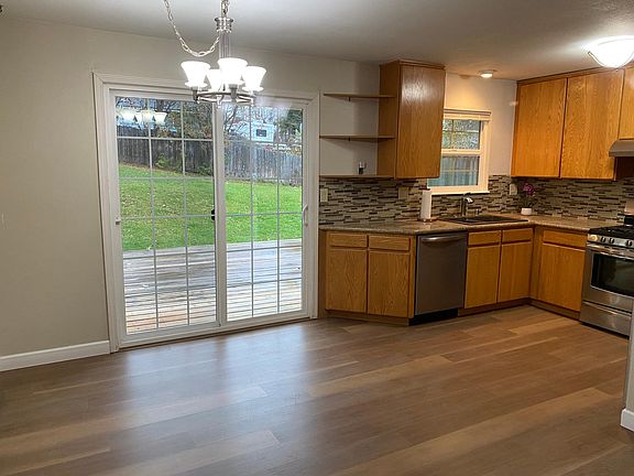Kitchen / dining area, sliding glass door to large deck and backyard