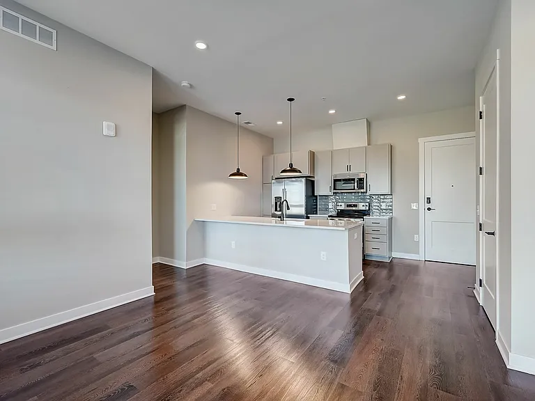 Midpoint Model Living Room to Kitchen