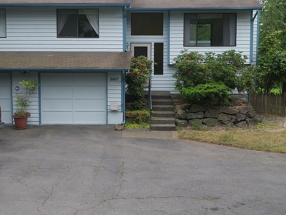 One car garage with 2 additional uncovered spots to the right
