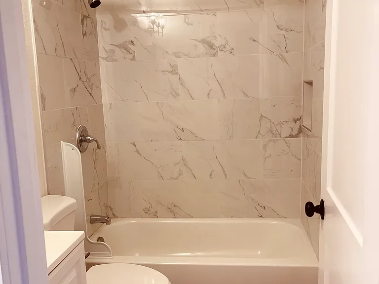 Tiled shower/bath.