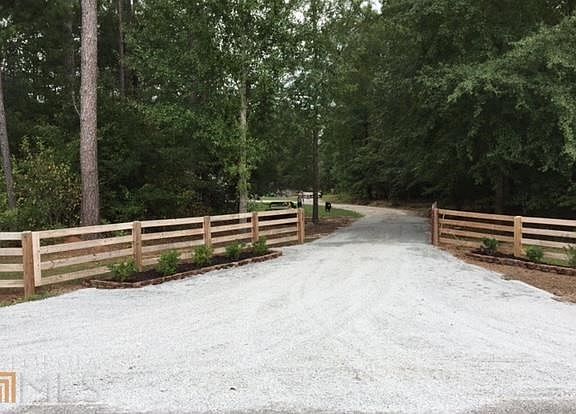 Improved and beautifully landscaped entrance is wide enough to accept entry of any rig or trailer.