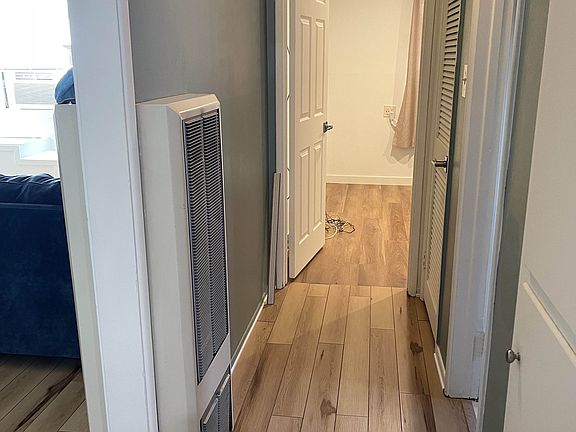 Hallway leads to 3 rooms. 2 bedrooms and 1 bathroom