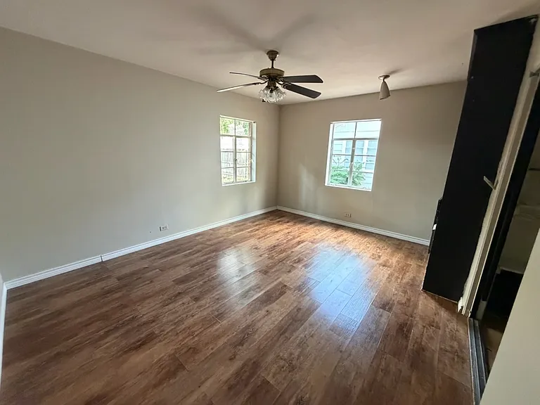 Bedroom #2: View from hallway. The bult-in cabinet is painted black.