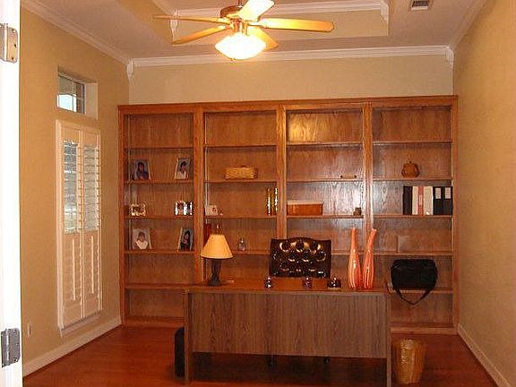 Hardwood floors, plnatation shutters, office or formal living
