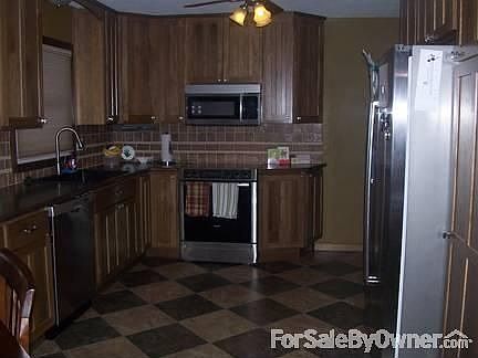 Newly remodeled kitchen : Bosch stainless appliances. New custom hickory cabinets, Nafco flooring, e