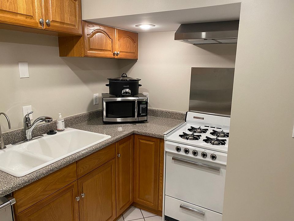 Double sink with disposal, gas stove with venting range hood and microwave