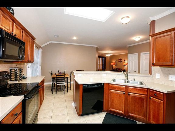 The kitchen has upgraded Cherry cabinets and lots of counter space, which makes meal preparation a snap!  You will also enjoy the upgraded Corian countertops.