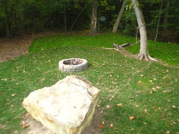 HUGE BACKYARD WITH FIRE-PIT & FLOWING CREEK TO THE REAR