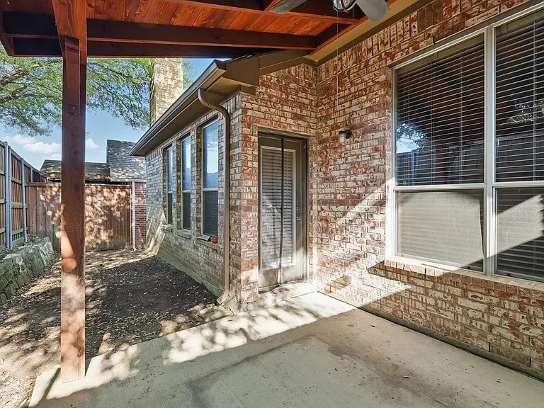 If your looking for a low maintenance back yard ( Landscape to come) this is for you, on the other side of the small yard is a grassy area for your pets. A full 10 ft fence for your privacy.