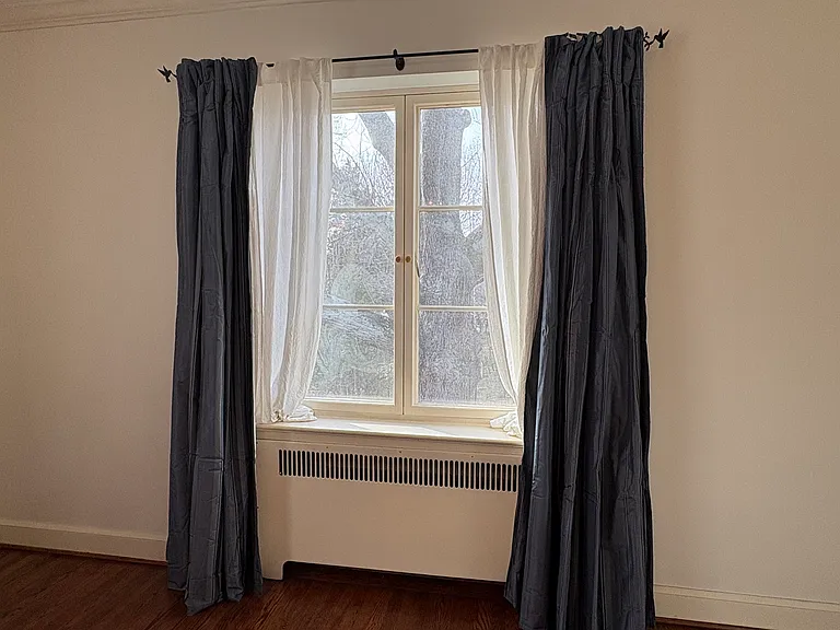 View of the 200+ yr old oak out of the french-casement windows in the Primary suite