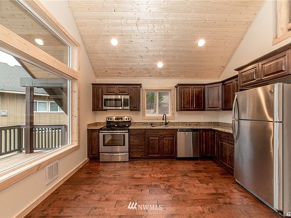 Photo shown is from a similar cabin. Interior finishes and color schemes have changed.