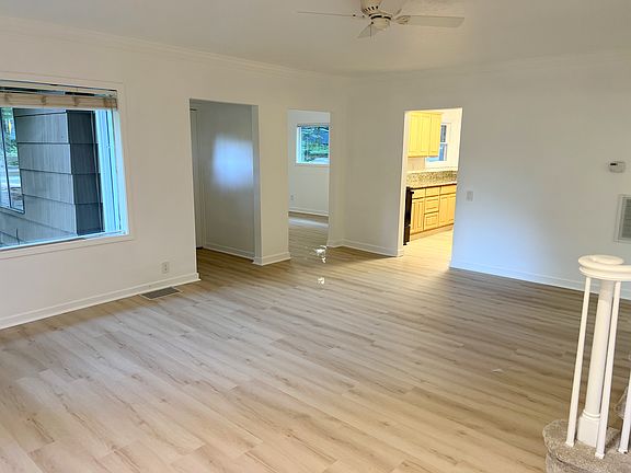 Back to outside wall looking through family room and Kitchen. Flex room to the left ahead of entry door