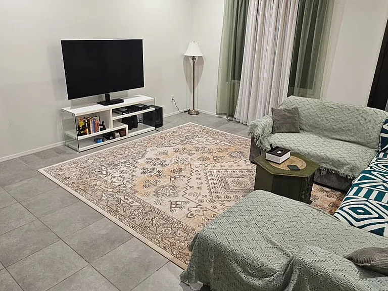 Shared Living Room - 1 sofa-cum-bed, TV, books, games.