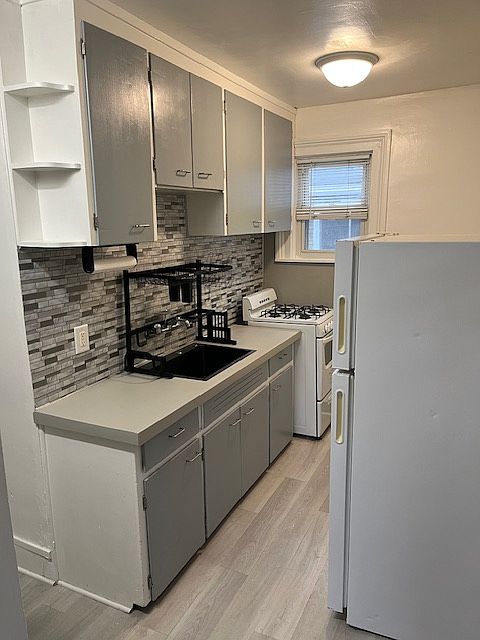 Kitchen with refrigerator and gas stove