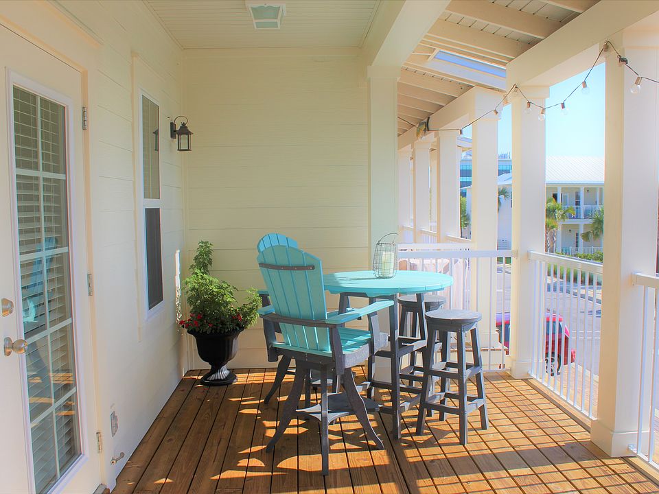 Private, oversized, covered second story porch with a great pool view.