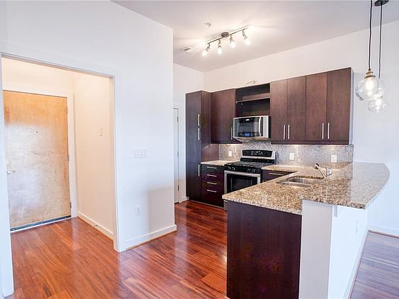 Kitchen with granite countertops and gas cooking, stainless steel appliances