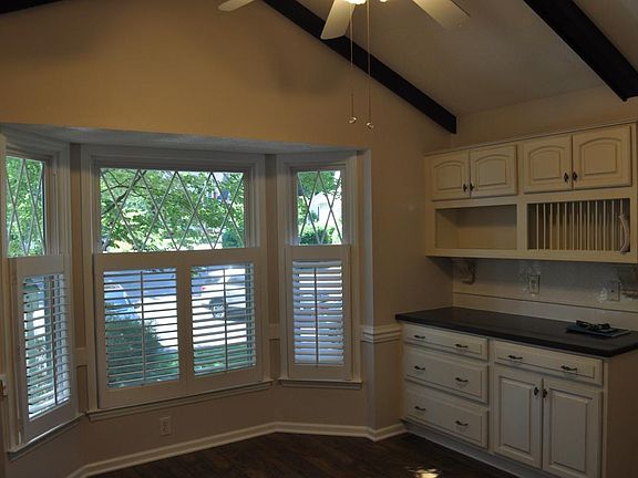 Kitchen with ample storage and room for breakfast table.