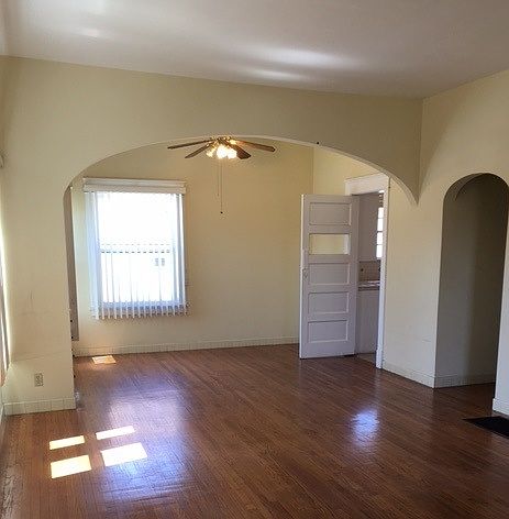 Living room has beautiful archway
