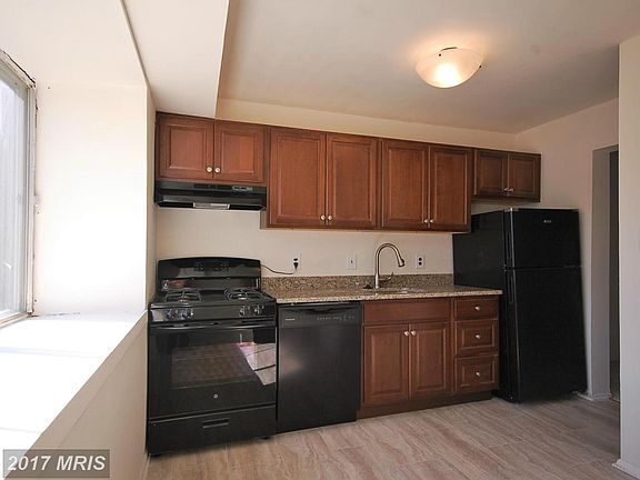 Updated kitchen with new tile floors and granite.