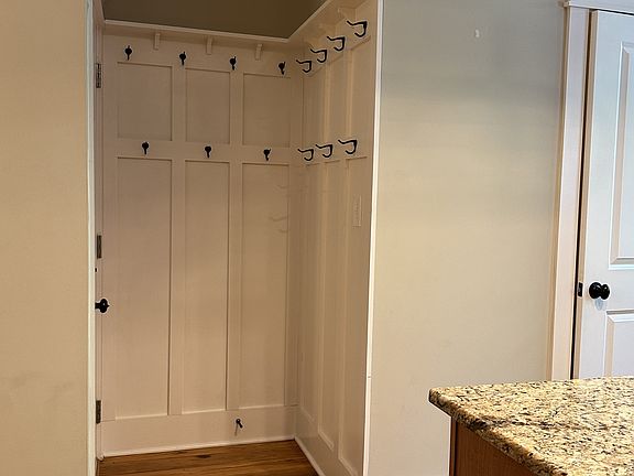 Entry Stairs from Garage Level, with Hanging Hooks for Coats