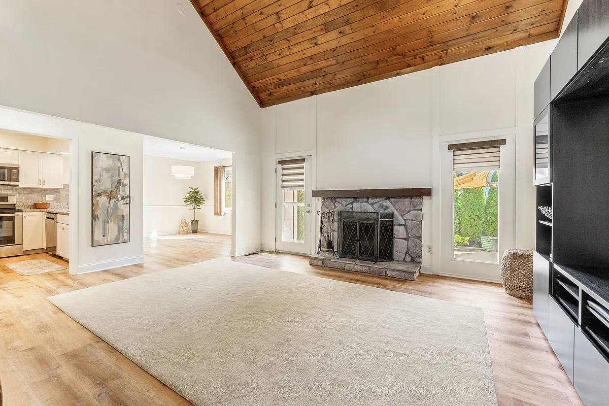 Living Room w/fireplace and TV Media Cabinet 
Beautiful wood vaulted ceilings - 6372 Dummerston Ct