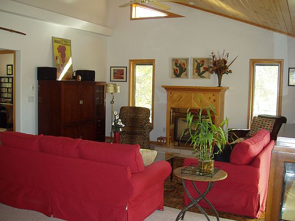 Cozy living room with natural gas fireplace overlooks Rock Creek