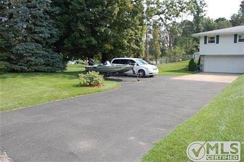 Driveway showing turn-around and ample parking for guests.