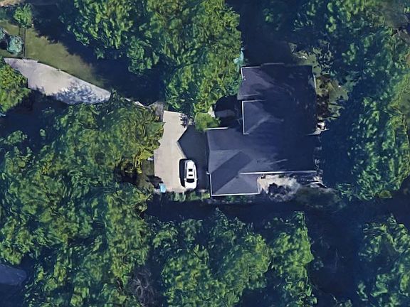 Sits on 3.2 wooded acres