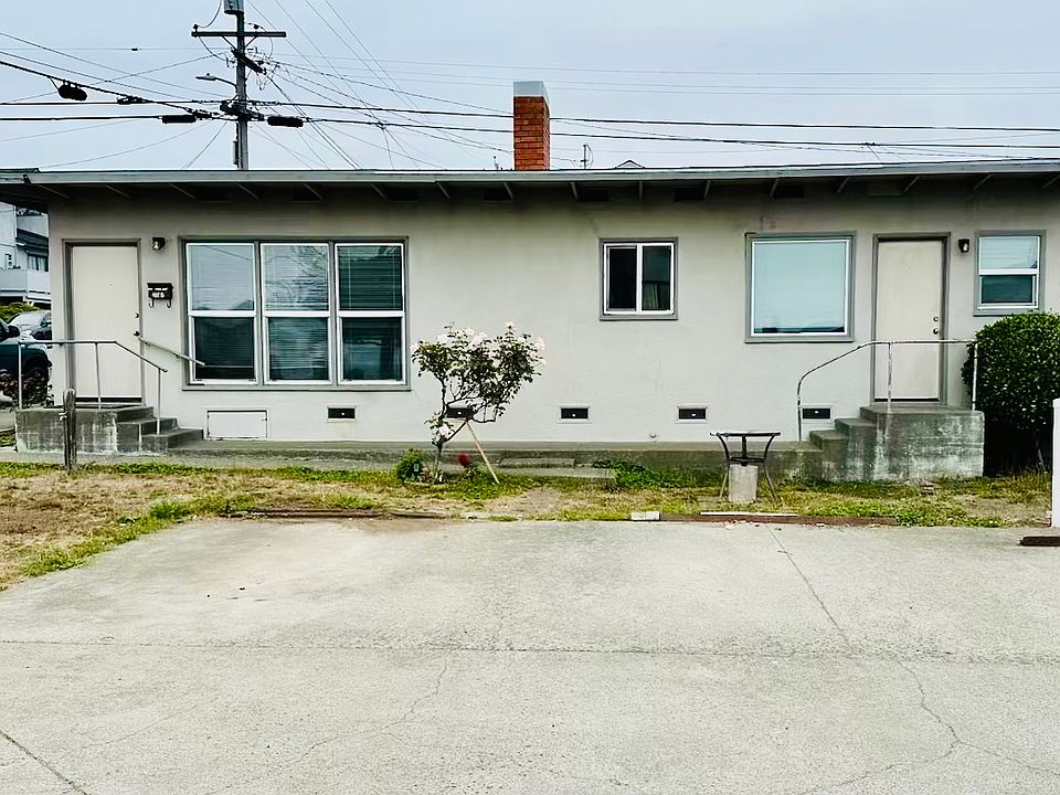 Front door is on the left. Separate entrance to laundry room on the right. Only 5 steps to entry to single level home. Two parking spaces in front.