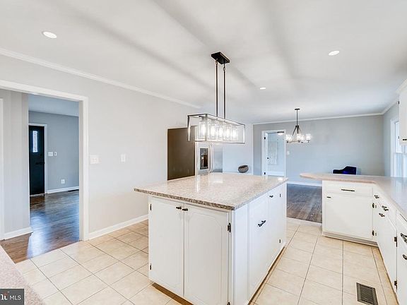 View from kitchen to front door and dining area