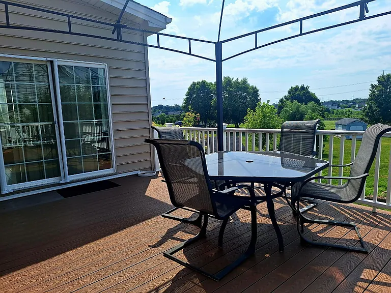 Relax on the spacious private deck with peaceful views_perfect for morning coffee, outdoor dining, or unwinding after a long day.